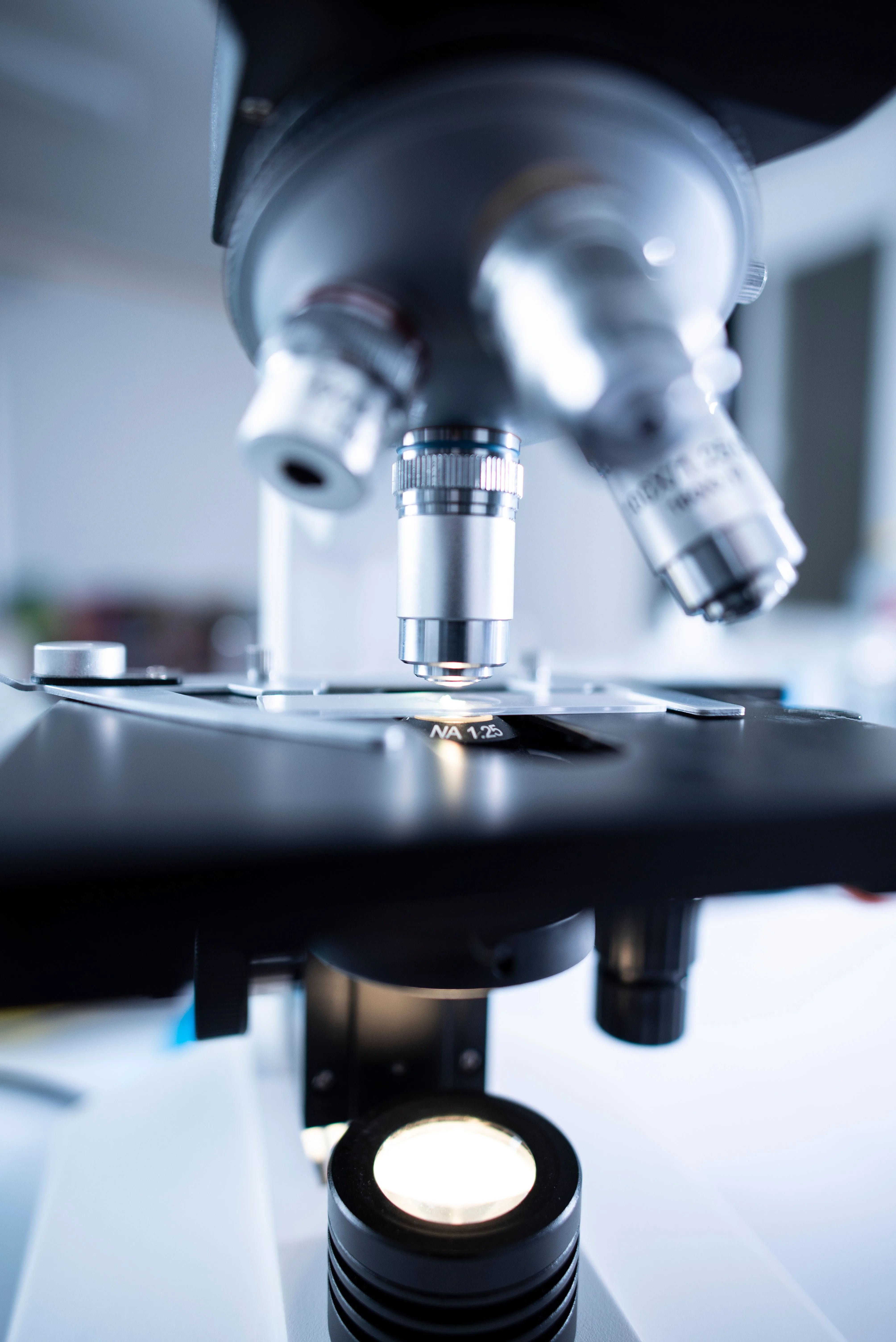 Close-up view of a laboratory microscope used for scientific and biological research