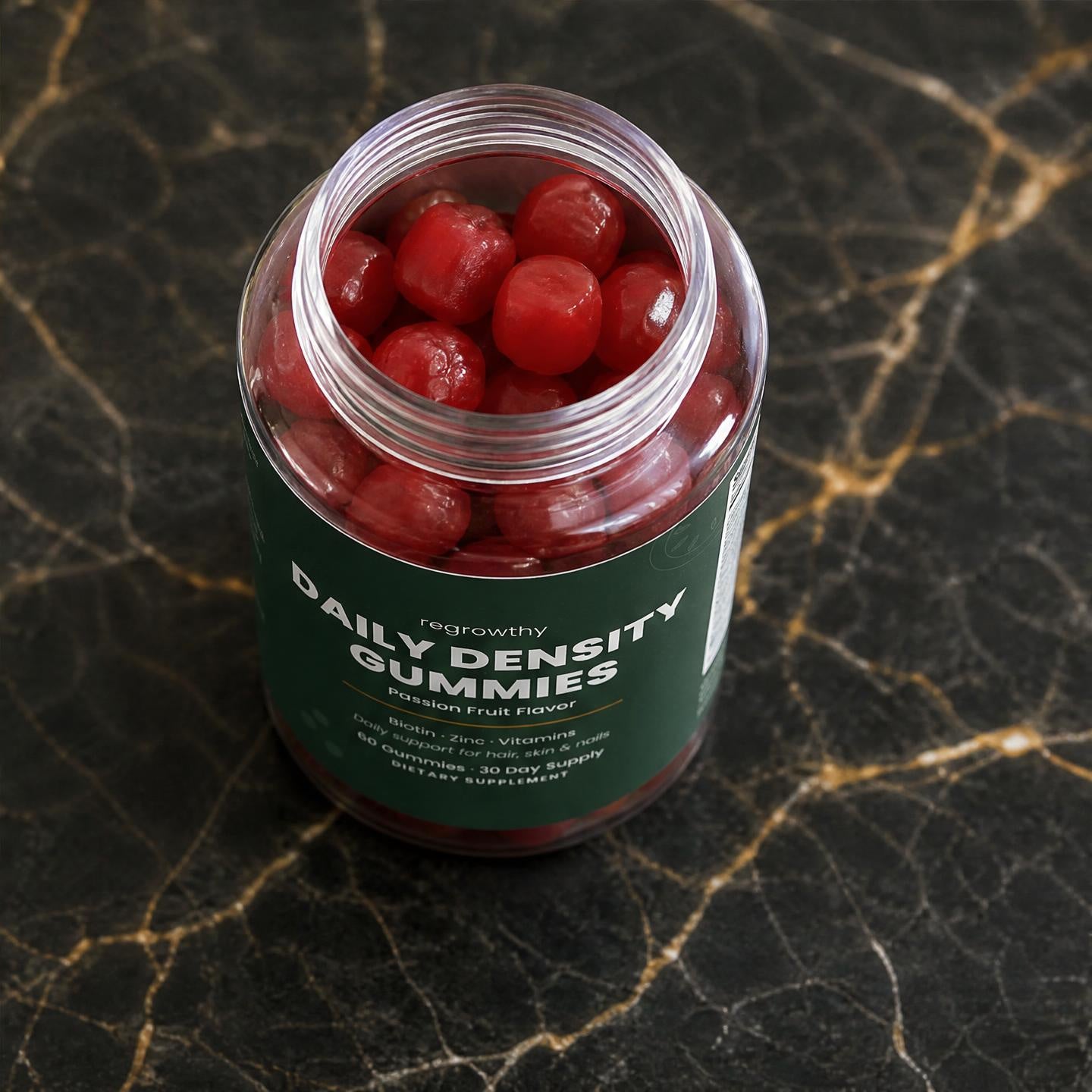 Daily Density Gummies open jar with passion fruit gummies
