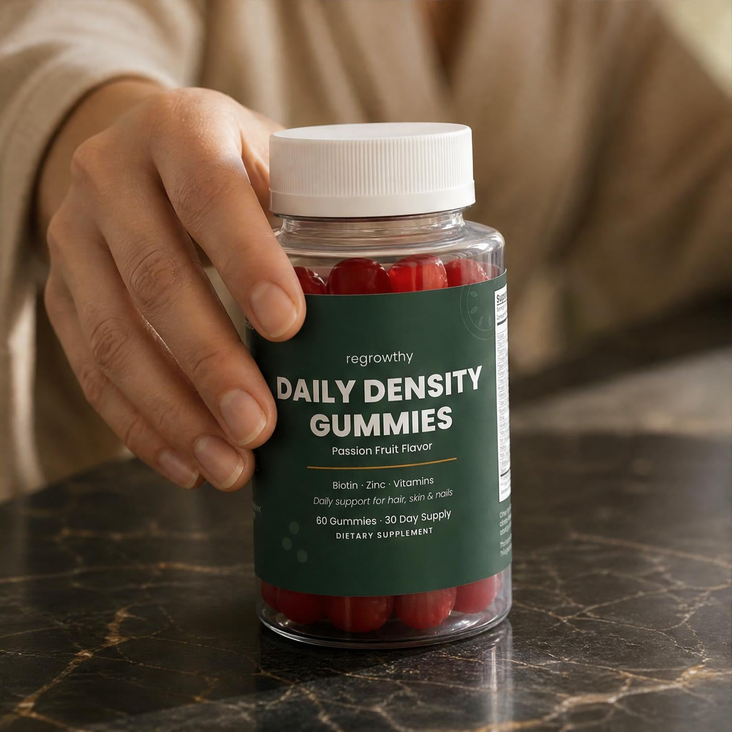 Daily Density Gummies in hand